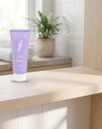 hideaway. Mini Vanilla Delight Body Scrub on a timber bathroom shelf beside rolled towels