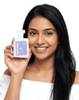 A smiling woman holding Hideaway. Bubba Hubba perfume