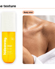 Body mist texture on a shoulder, beside Hideaway. Pineapple Coconut body mist