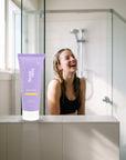 hideaway. Pineapple Coconut Shower Mousse on a shower ledge in a bright bathroom
