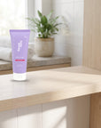 hideaway. Aurora Rouge Shower Mousse on a pale timber vanity top in a bright bathroom