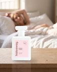 hideaway. Sweet Thing perfume 50ml bottle on a bedside table in warm morning light