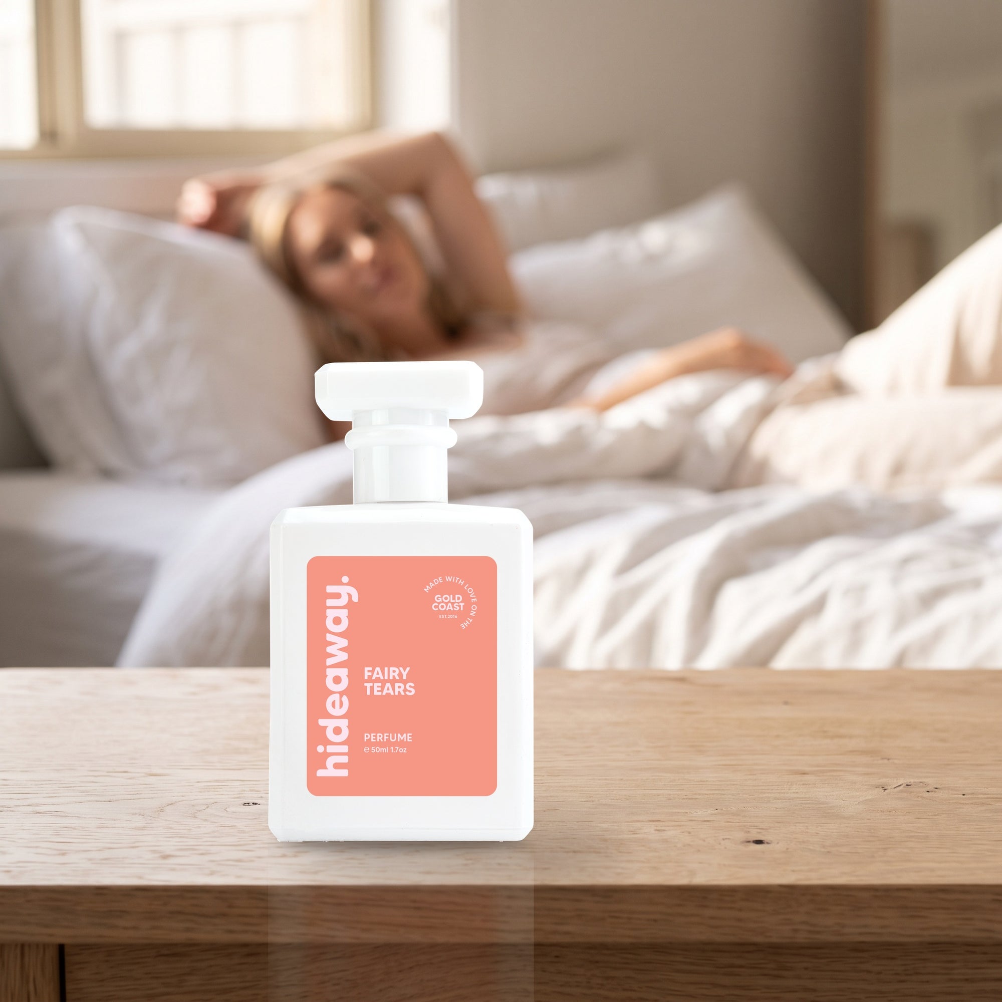 hideaway. Fairy Tears perfume 50ml bottle on a bedside table in warm morning light