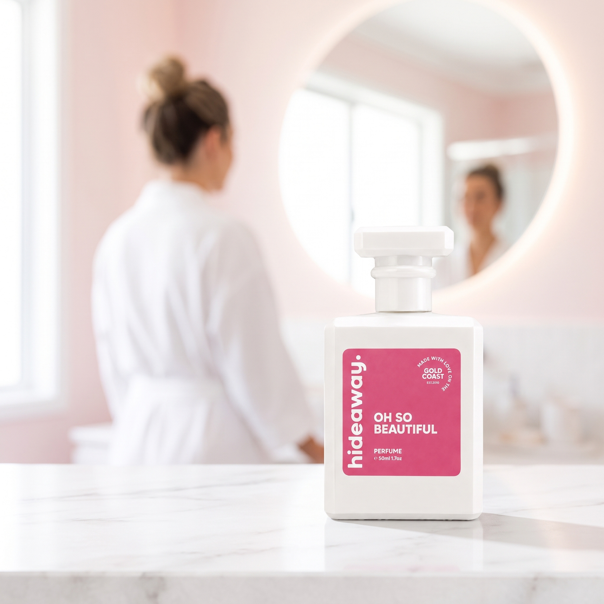 hideaway. Oh So Beautiful perfume 50ml bottle on a marble vanity in soft daylight