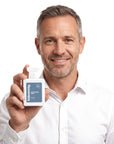 A smiling man holding Hideaway. Centurion Man perfume