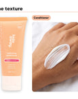 Conditioner texture swiped on a hand, beside Hideaway. Aurora Rouge mini conditioner