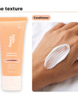 Conditioner texture swiped on a hand, beside Hideaway. Black Essence mini conditioner